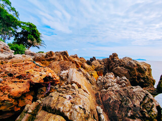 View of golden rocks and beautiful sea at Ao Thong Nod, Khanom, Nakhon Si Thammarat, Thailand