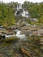 Tuinposter Watervallen Waterfall in autumn Norwegian mountains. Long exposure time.  © pettys