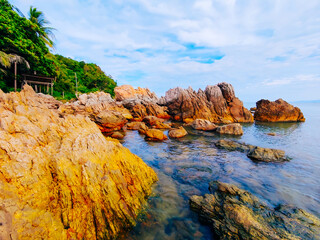 View of golden rocks and beautiful sea at Ao Thong Nod, Khanom, Nakhon Si Thammarat, Thailand