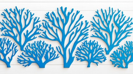 Fototapeta premium Blue coral silhouettes on white wooden background.