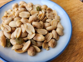 Peanut nut and dried fruit on wood background