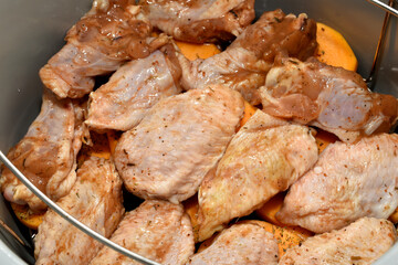 Raw marinated chicken wings on a plate. High quality photo