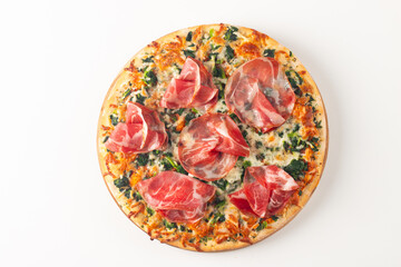 Pizza with prosciutto, ham, arugula, spinach, tomatoes, pesto, cheese and parmesan. Italian cuisine. 