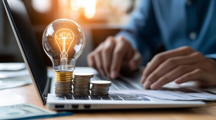 Innovation Finance, light bulb on coins, laptop, person typing, concept of idea generation and financial growth.