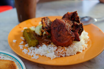 Traditional Malaysian Nasi Kandar with Fried Chicken and Okra on Rice