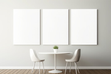 A minimalist dining setup featuring two white chairs, a small table, and three blank canvases on a neutral wall