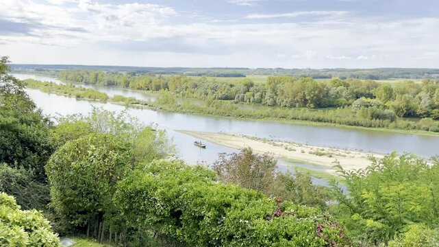 Stunning View from Chaumont-sur-Loire Castle Overlooking the Serene Loire River and Verdant Landscape Under a Beautiful Cloudy Sky