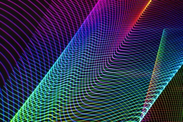 Fototapeta premium A colorful, abstract image with a rainbow of colors. The image is a representation of a wave, with the colors blending together to create a sense of movement and energy. Scene is one of excitement