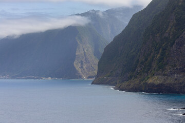 Seixal coastline with big cliffs and the village of São Vicente in background. Madeira island, Portugal