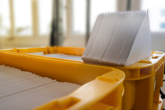 Mailbox with letter mailing sorted by zip code for delivery and postage optimization when sending mail. Inserting machine mail letter print production business.