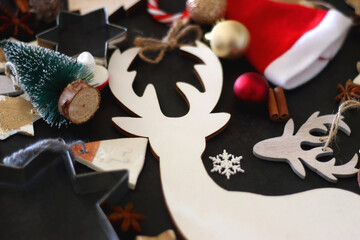 Various Christmas decorations in neutral colors on dark background. Selective focus.