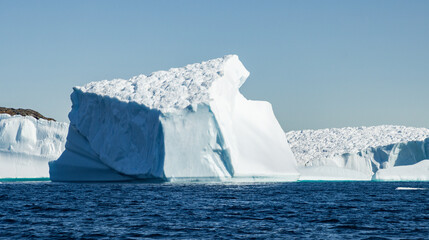 View of glaciers and icebergs in the fjords of South Greenland.