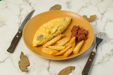 Omelet with Fries and Sausage on a Plate