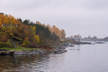 Oslo, Norway - October 20, 2024: Oslofjord (Oslofjorden), view of the bay and the island. Autumn forest