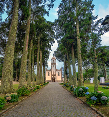 Obraz premium The pretty chucrh and main square of the picturesque village of Sete Cidades, São Miguel Island, Azores Islands, Portugal