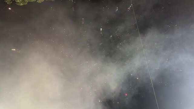 Sky shot firecracker in the sky video on the festival of diwali in India. One huge explosion of fireworks with falling threads. Single firework at night. Spectacular single firework 3d render. 