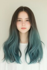 Portrait of a Young Woman with Long Straight Hair and a Natural Expression in a Studio Setting