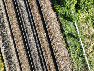 two railway tracks seen from directly above, drone view