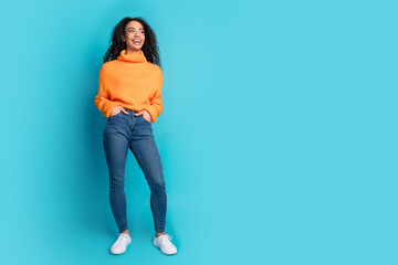 Full body portrait of nice young girl look empty space isolated on turquoise color background
