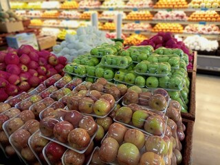 A grocery store filled with various types of fresh fruits.