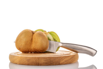 Two halves of ripe juicy kiwi with a knife on a wooden tray, macro, isolated on white background.