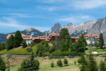 Elegant hotel and cerro catedral at background, san carlos de bariloche, argentina