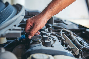Close up Man hands fixing Car machinery vehicle mechanical service. Mechanic man hands repairing...