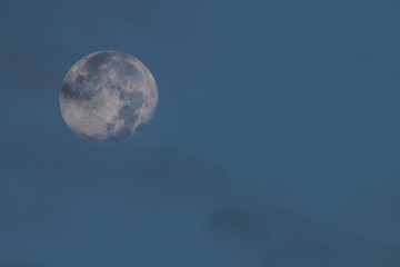 View of the full moon over blue sky