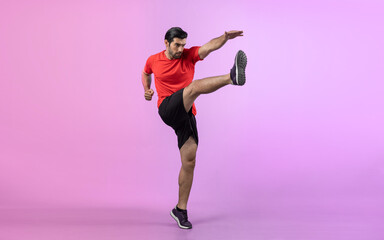Full body length gaiety shot athletic and sporty young man with fitness in cardio exercise, kicking position posture on isolated background. Healthy active and body care lifestyle.