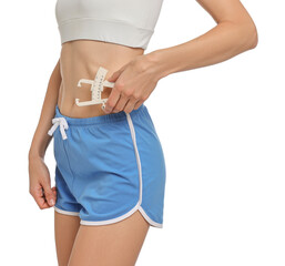 Woman measuring body fat with caliper on white background, closeup