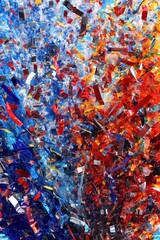 Vibrant abstract texture with colorful confetti explosions in red and blue tones