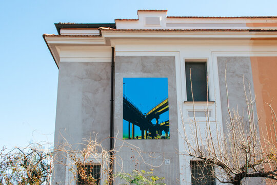 House with image of elevated road in the Pigneto neighborhood of Rome. Pigneto, Tangenziale. Rome, Italy, 2023.