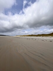 beach and sea with a hint of the rolling hills and sand dunes Ireland co Donegal