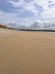 beach and sea with a hint of the rolling hills and sand dunes Ireland co Donegal