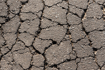 Cracked asphalt texture. Top view. Asphalt. Road background