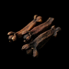 Fototapeta premium Whole Clove Spice Against Deep Black Background Sharp Aromatic Detail
