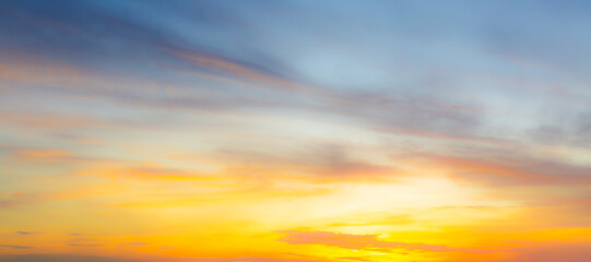 Clouds and sky background,Beautiful Vivid sky painted by the sun leaving bright golden shades