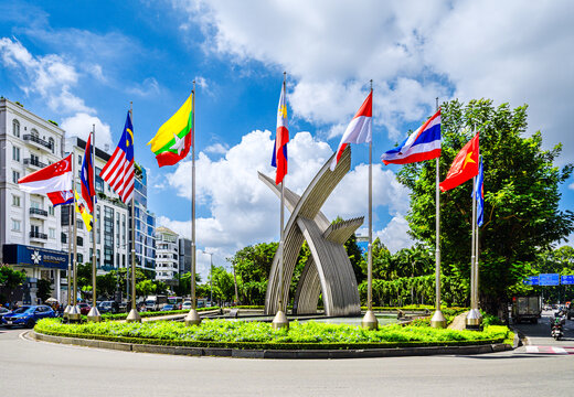 View of symbol of the gateway to Tan Son Nhat International Airport of Ho Chi Minh City, Vietnam with flags of ASEAN countries