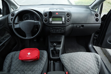 Fototapeta premium First aid kit on car seat