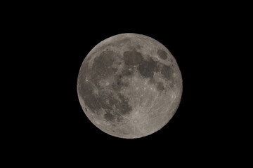 Fototapeta premium Full moon on night black sky, moon isolated on night sky