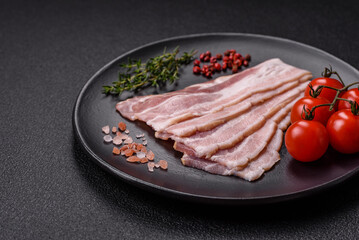 Fresh raw bacon sliced with spices and herbs