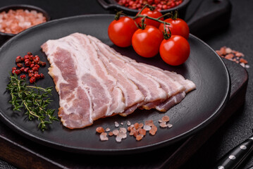 Fresh raw bacon sliced with spices and herbs