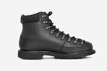 Black leather boots isolated on white background. Fashionable and durable footwear for men and women. Ideal for casual and outdoor wear in autumn and winter 