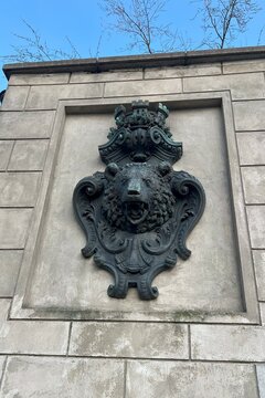 This detail features the Berliner Bear, the iconic symbol of Berlin, elegantly crafted as a door knocker in the Liebknecht Br&uuml;cke area, showcasing local heritage.