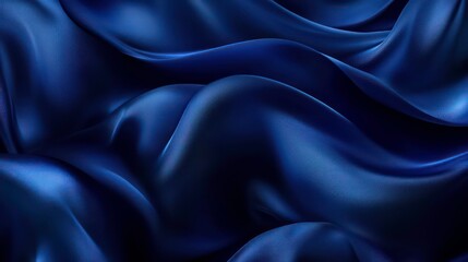 Obraz premium Abstract background of smooth, flowing, deep blue satin fabric with a soft sheen.