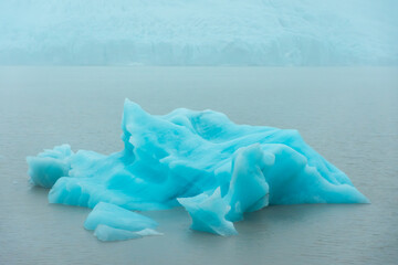 Icebergs from the melting Fjallsjokull Glacier under the rain,  Iceland