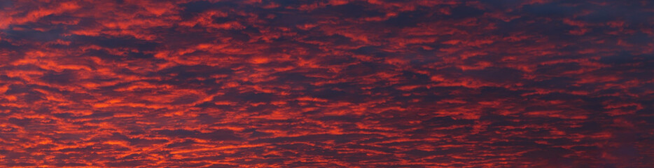 Cloudy sunset with gentle colorful clouds.