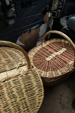 Woven baskets for mushroom picking placed inside rustic vehicle