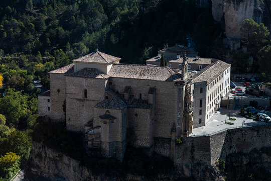 Historic monastery on the cliffs surrounded by forest in Cuenca, Spain