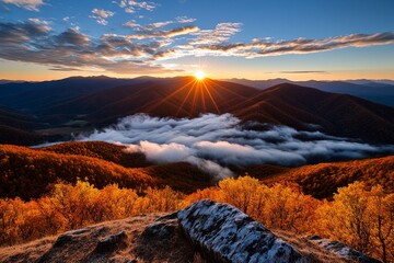 Obraz premium Sunrise over the Knuckles Mountain Range, with dramatic peaks bathed in golden light and clouds drifting below